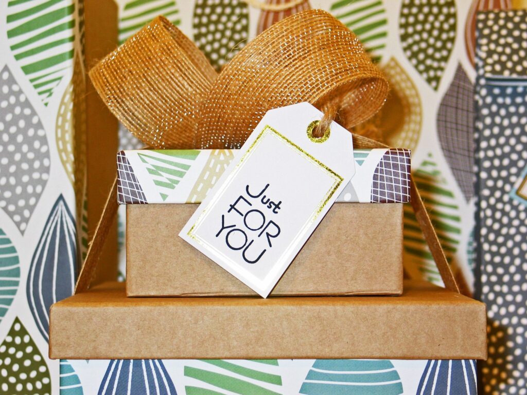 Gift box with large bow and "Just for You" tag"