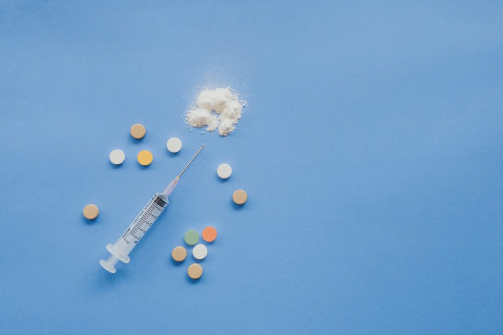 Syringe with crushed pill and other pills
