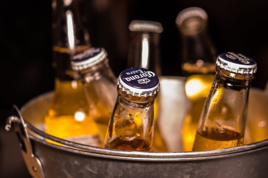 Closeup shot of beer bottles in bucket